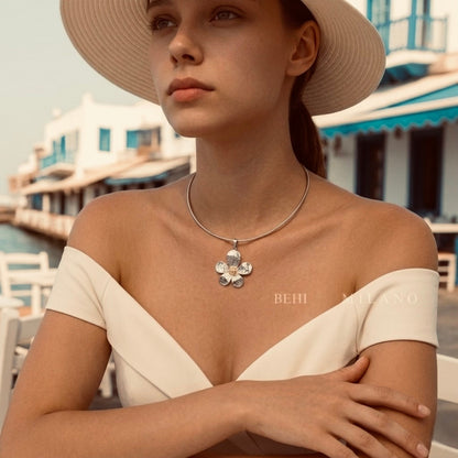 BEHI MILANO Bloom Choker — close-up portrait of model wearing silver flower pendant collar necklace