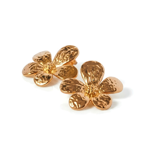 BEHI MILANO Bloom Earrings — 18k gold-plated hammered flower stud earrings on white background