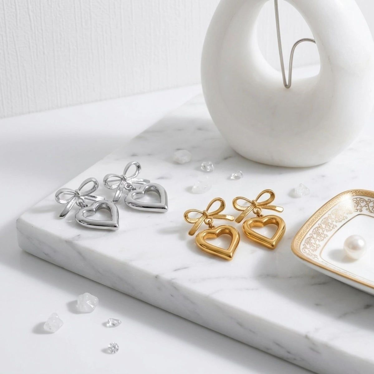 BEHI MILANO Cara Earrings — silver and 18k gold ribbon bow heart drop earrings pair display