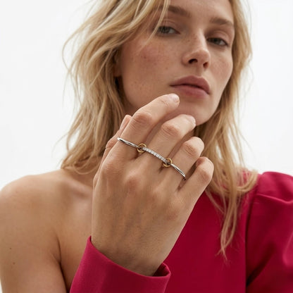 BEHI MILANO Carlita Ring — model in fuchsia top wearing multi-finger silver and gold pave ring