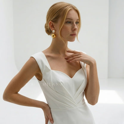 BEHI MILANO Carollina Earrings — model wearing 18k gold pearl cabochon and ball drop earrings with bridal gown