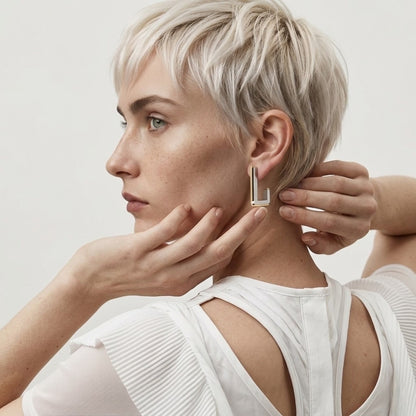 BEHI MILANO Cindy Earrings — side view of model wearing geometric dual-color earrings
