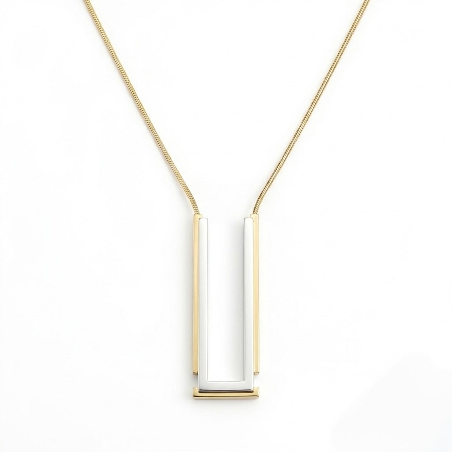 BEHI MILANO Cindy Necklace — two-tone silver and 18k gold rectangular pendant necklace on white background
