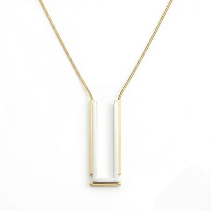BEHI MILANO Cindy Necklace — two-tone silver and 18k gold rectangular pendant necklace on white background