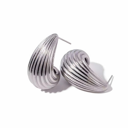 BEHI MILANO Claire Earrings — silver-tone stainless steel ribbed drop stud earrings on white background