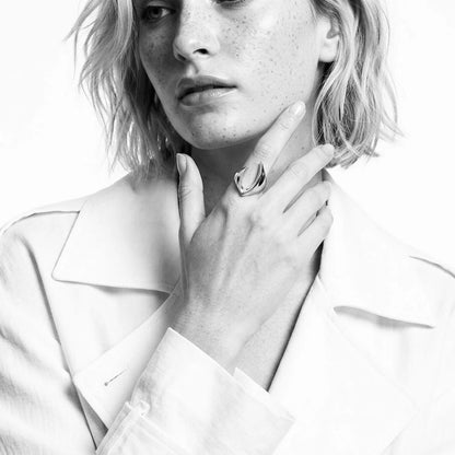 BEHI MILANO Clarissa Ring — black and white fashion portrait of model wearing statement ring on index finger