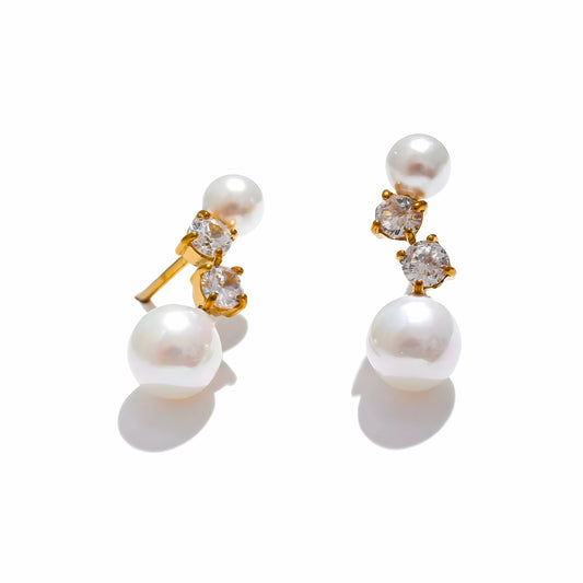 BEHI MILANO Diana Earrings — 18k gold-plated stud earrings with double white pearls and cz stones on white background