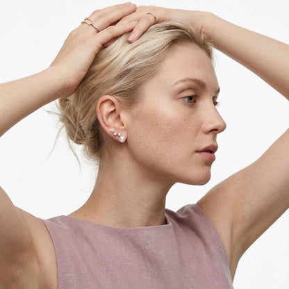 BEHI MILANO Diana Earrings — model wearing elegant gold pearl and cubic zirconia studs