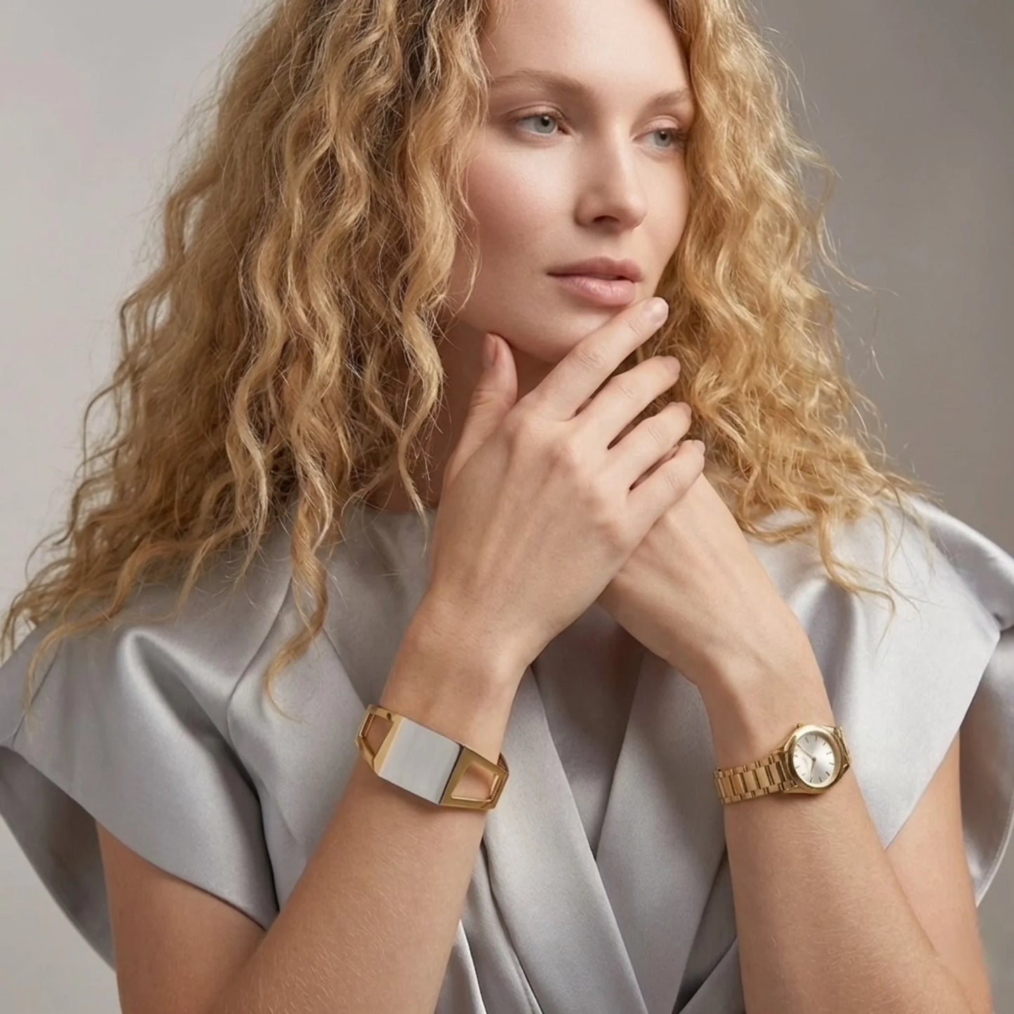 BEHI MILANO Dimitra Bracelet — model posing with two-tone architectural cuff bracelet on wrist