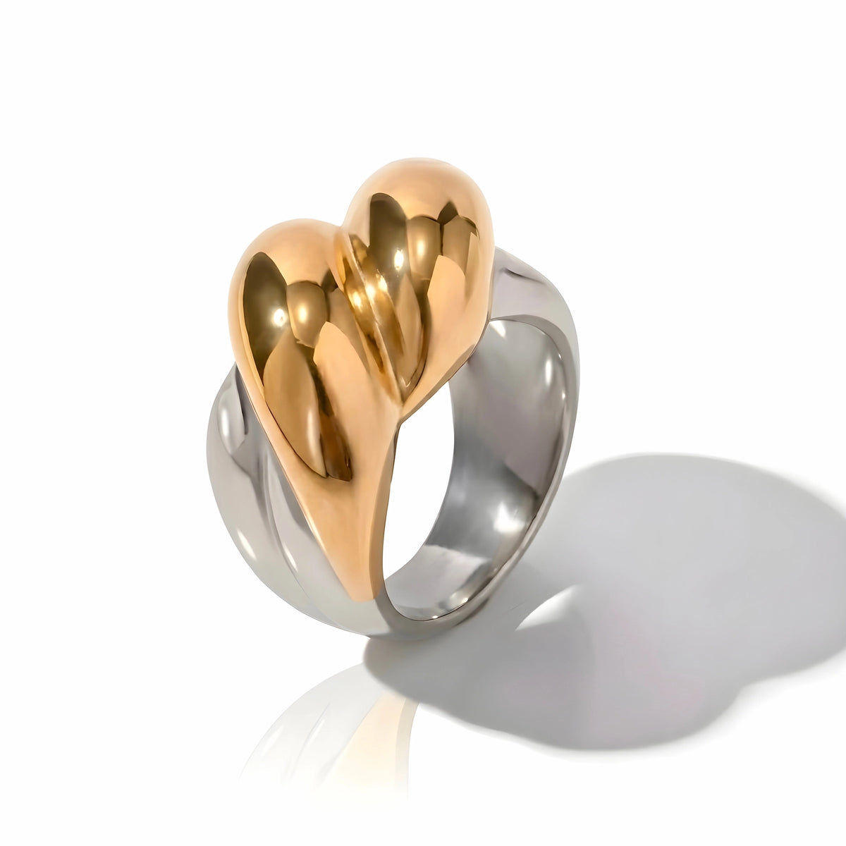 BEHI MILANO Disha Ring — 18k gold and silver two-tone abstract heart sculptural ring on white background