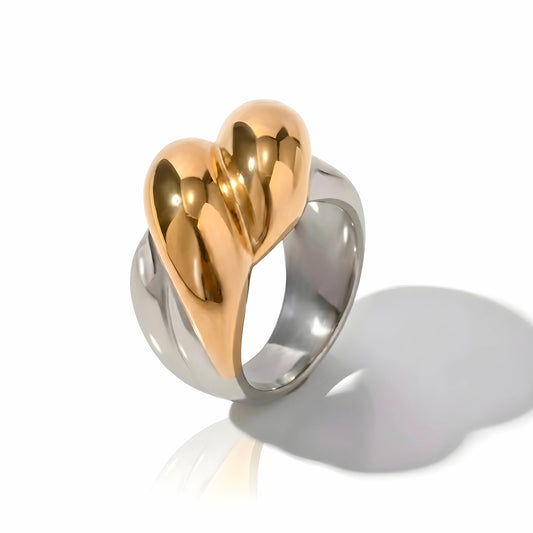 BEHI MILANO Disha Ring — 18k gold and silver two-tone abstract heart sculptural ring on white background