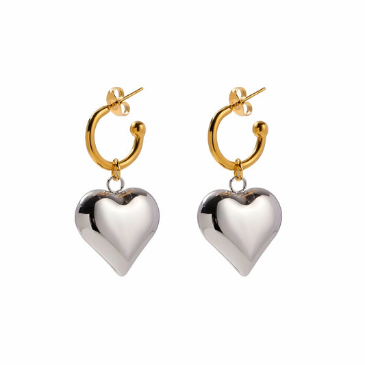 BEHI MILANO Emma Earrings — gold hoop earrings with silver puffy heart drop charms on white background