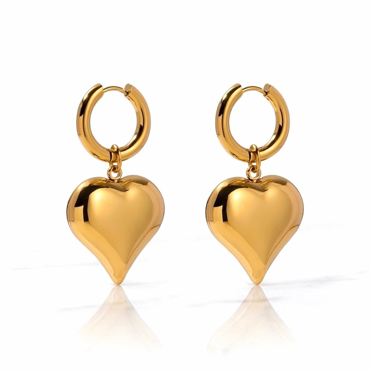 BEHI MILANO Emma Hoop Earrings — 18k gold puffy heart drop huggie hoop earrings on white background