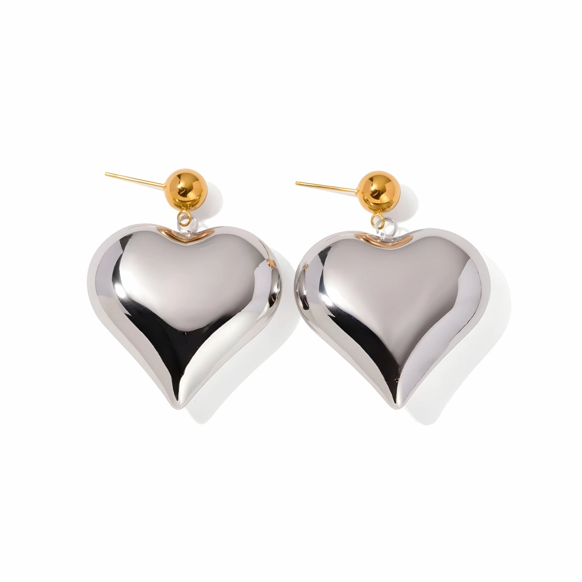 BEHI MILANO Emma XL Earrings — oversized silver puffy heart drop earrings with gold ball studs on white background