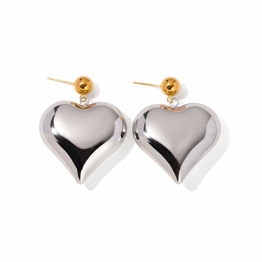 BEHI MILANO Emma XL Earrings — oversized silver puffy heart drop earrings with gold ball studs on white background