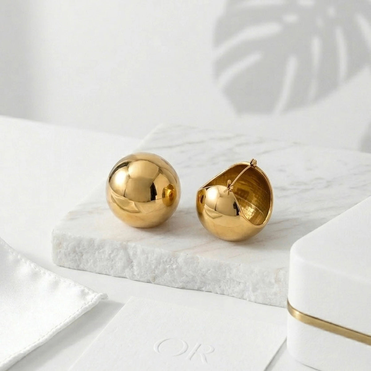 BEHI MILANO Erika Earrings — polished gold spherical dome earrings close-up display
