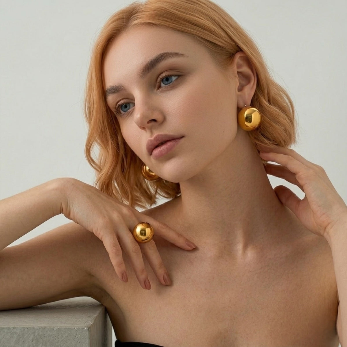 BEHI MILANO Erika Ring — high fashion model wearing gold sphere dome statement ring