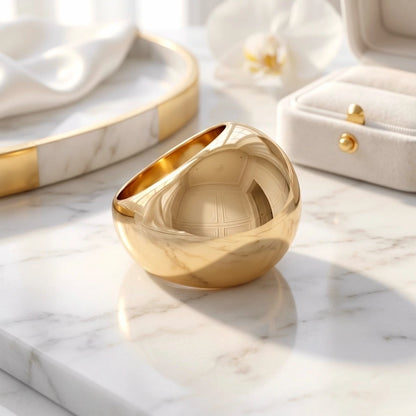 BEHI MILANO Erikan Ring — gold chunky sphere dome ring displayed on white marble