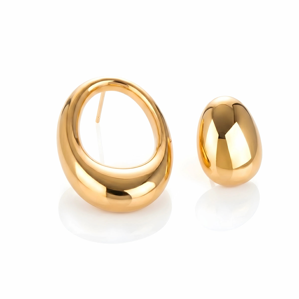 BEHI MILANO Fiona Earrings — 18k gold asymmetric sculptural drop earrings on white background