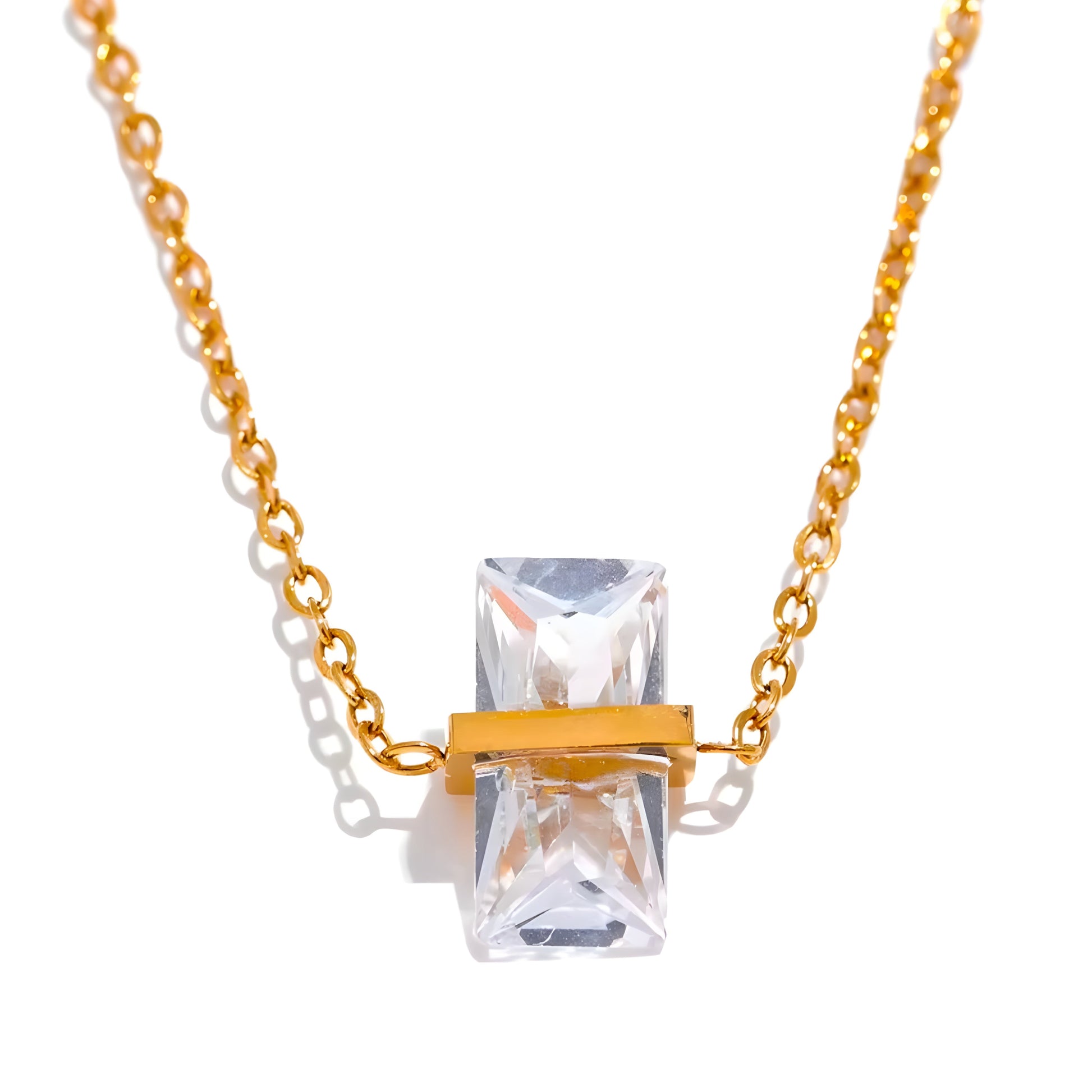 BEHI MILANO Glinka Necklace — clear crystal gemstone pendant necklace on marble next to luxury box