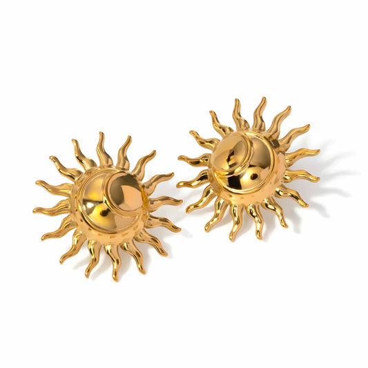 BEHI MILANO Glow Earrings — pair of 18k gold stylized sun statement stud earrings on white background