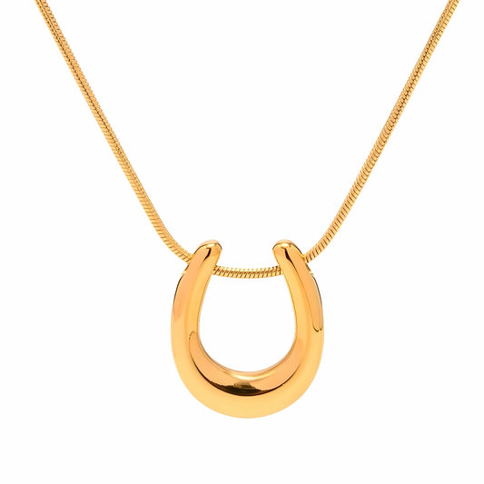 BEHI MILANO Horseshoe Necklace — 18k gold polished horseshoe pendant necklace on white background