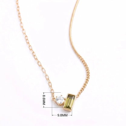 BEHI MILANO Ilona Necklace — detailed view of clear and green zircon gemstone settings