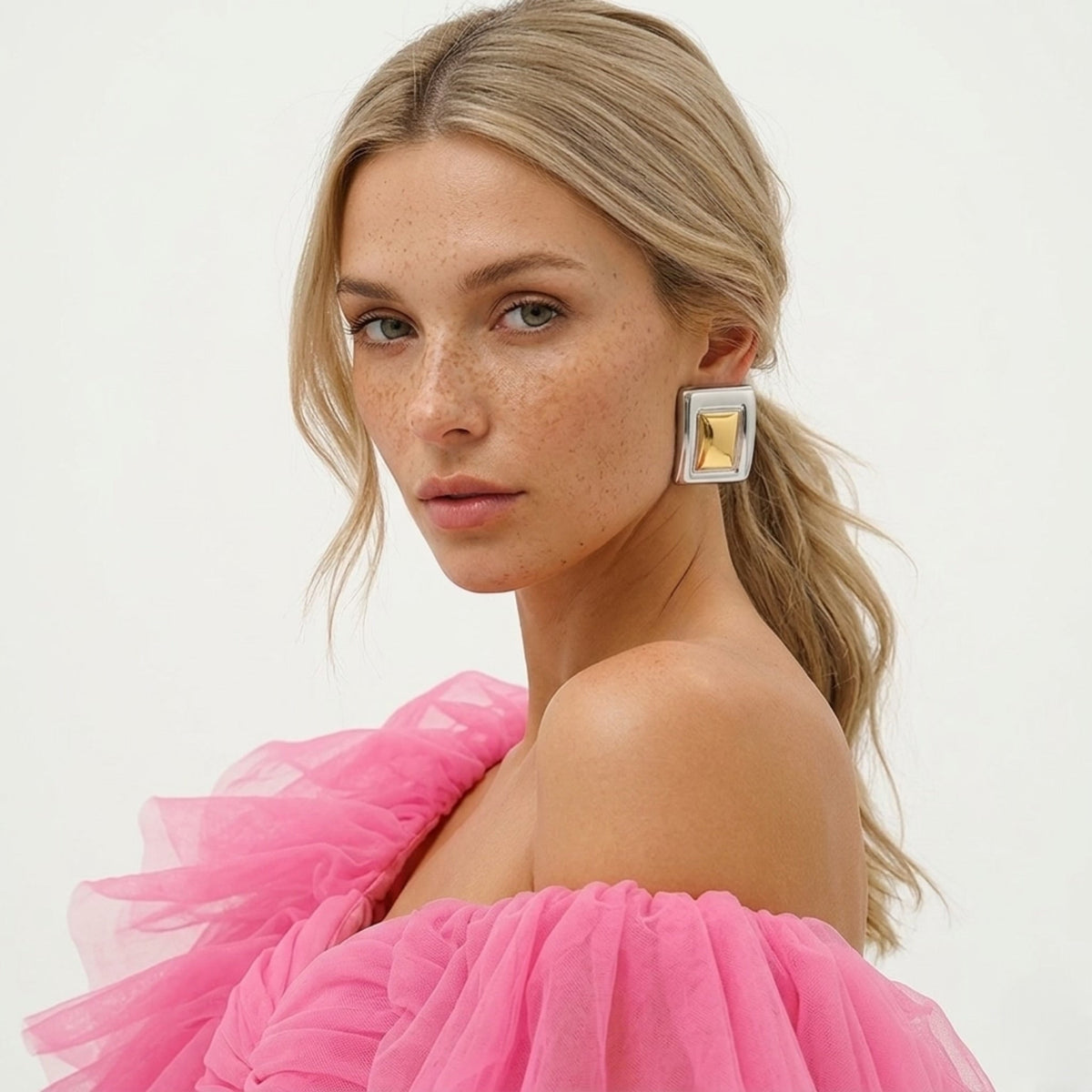 BEHI MILANO Isabella Earrings — side profile portrait of model wearing two tone geometric square earrings