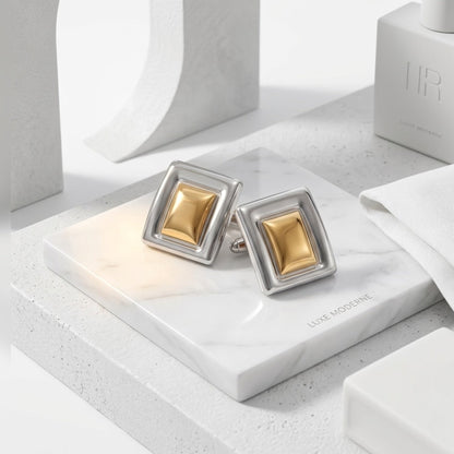 BEHI MILANO Isabella Earrings — two tone gold and silver studs on white geometric marble blocks