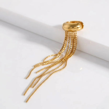 BEHI MILANO Iskra Ear Cuff — diagonal studio view of gold cartilage cuff with flowing chains