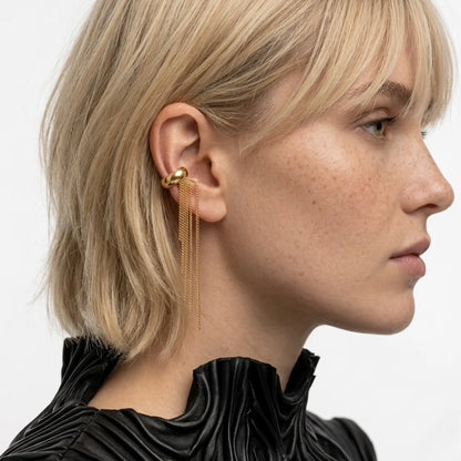BEHI MILANO Iskra Ear Cuff — close up side profile of model wearing 18k gold cascading chain ear cuff