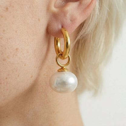 BEHI MILANO Jade Earrings — side angle view of gold pearl hoop earring on earlobe