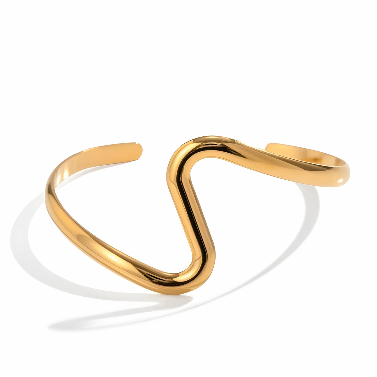 BEHI MILANO Jojo Bracelet — 18k gold sculptural S-wave open cuff bracelet on white background