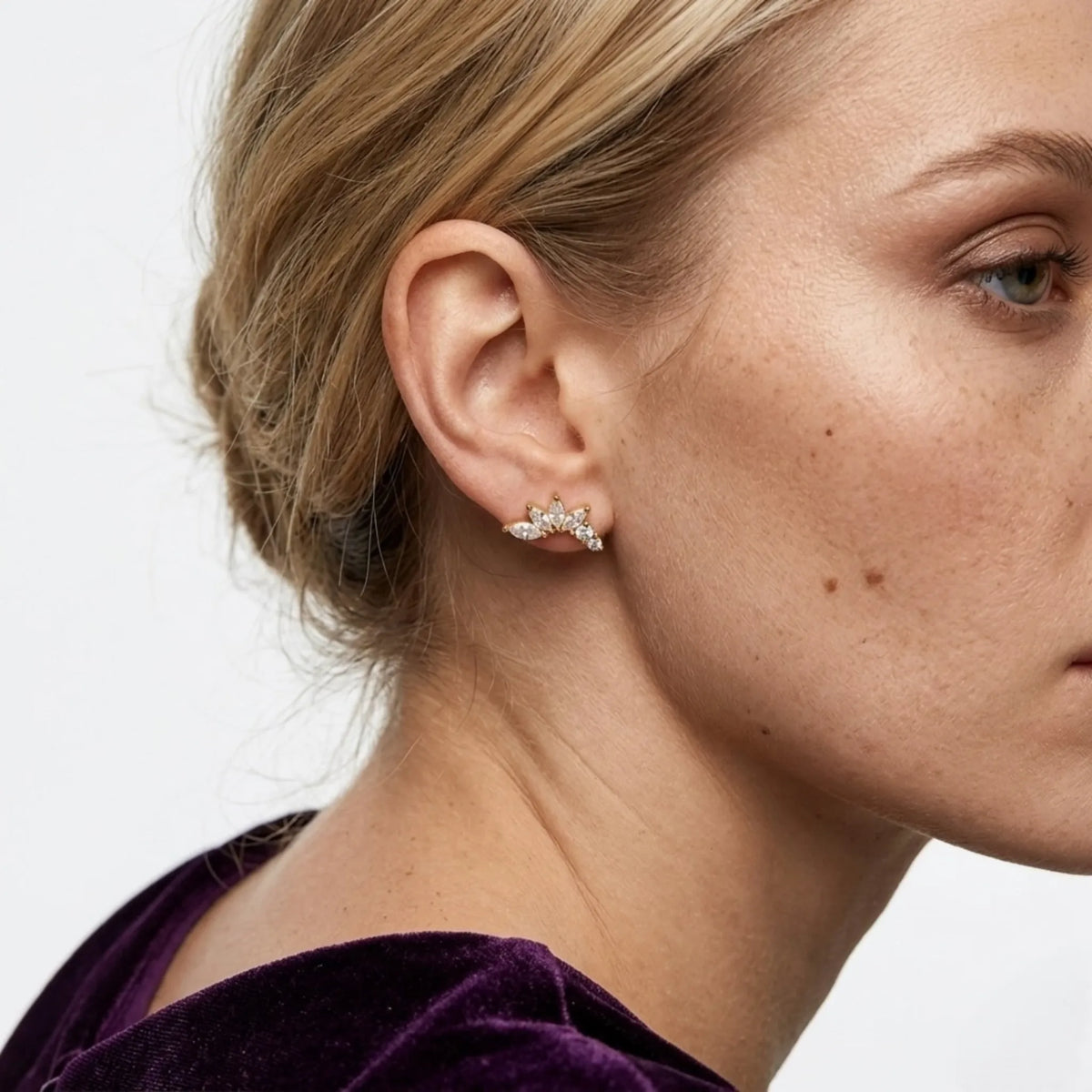 BEHI MILANO Josa Earrings — blonde model displaying 18k gold marquise crystal stud earrings