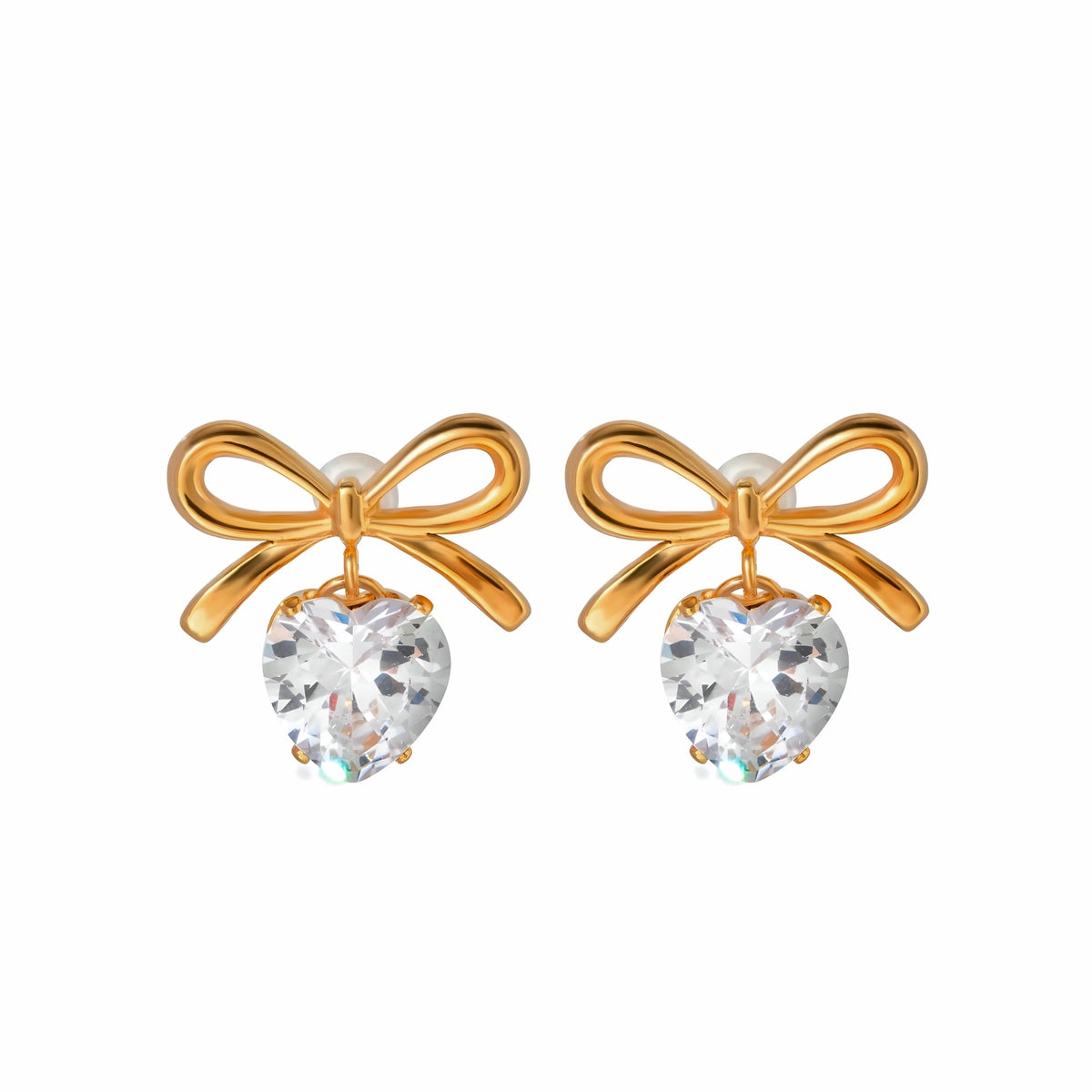 BEHI MILANO Juliette Earrings — 18k gold bow stud earrings with heart crystal drops on white background