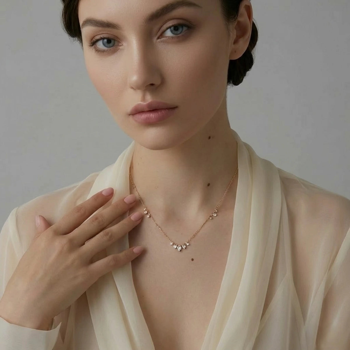 BEHI MILANO Larissa Necklace — model wearing delicate gold crystal drop necklace with sheer top