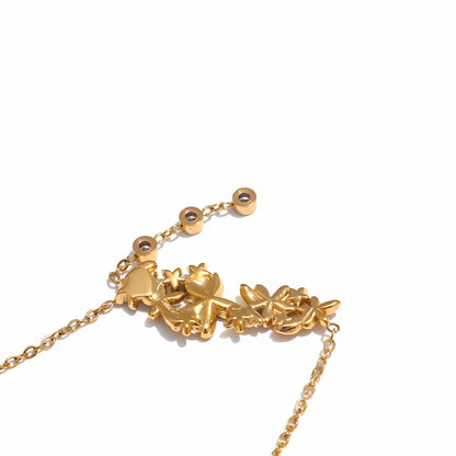 BEHI MILANO Lauris Necklace — detailed angle shot of 18k gold-plated floral motif and dangling zircon stone