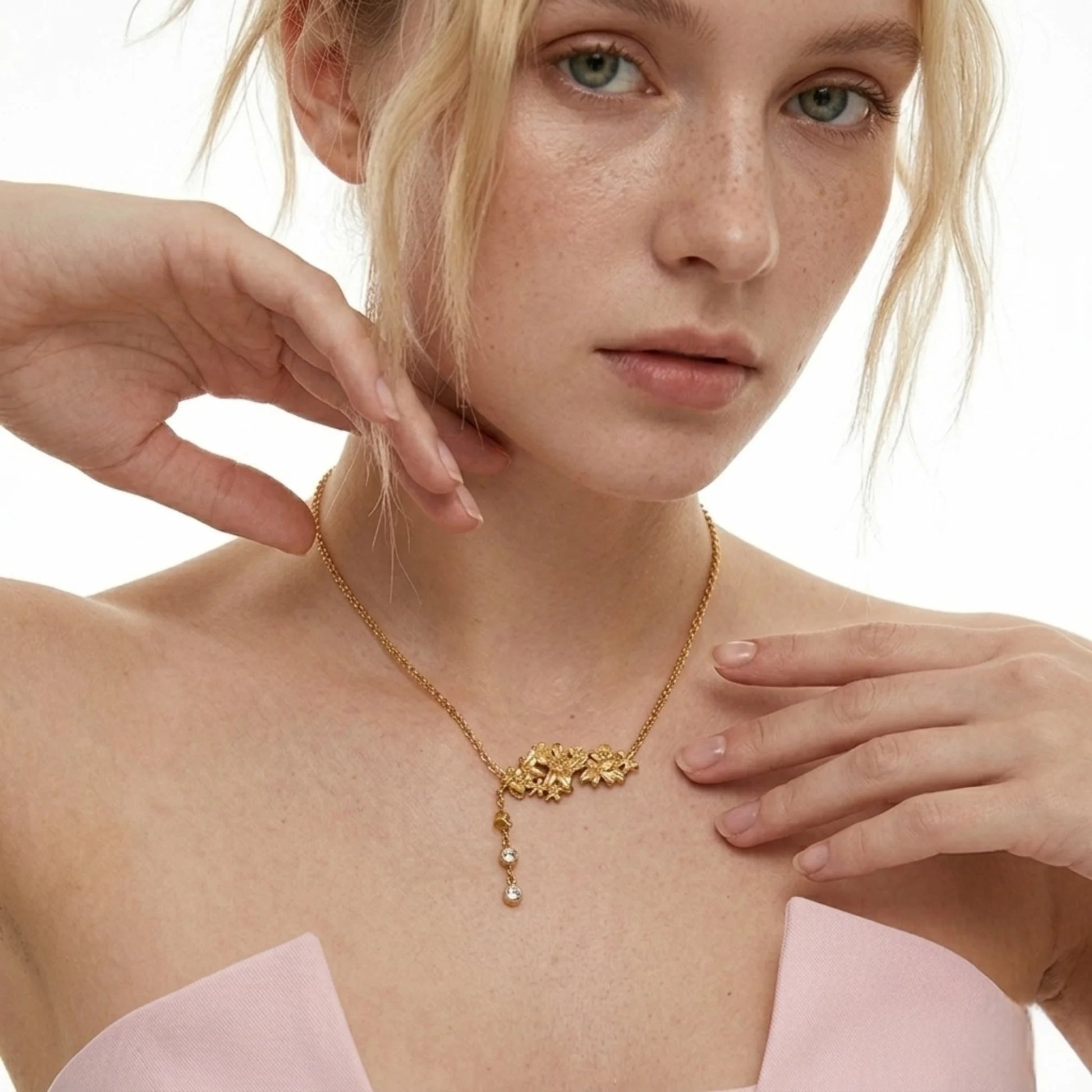 BEHI MILANO Lauris Necklace — model wearing 18k gold floral crystal drop necklace with pink silk dress