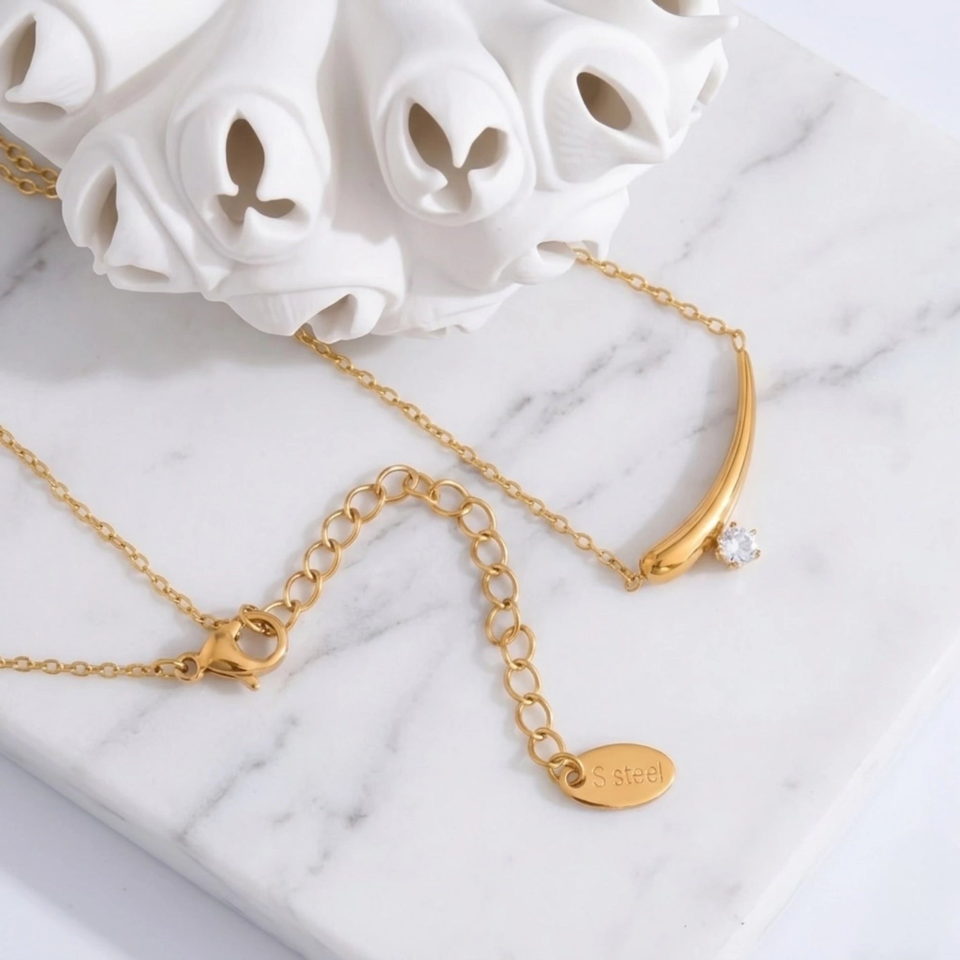 BEHI MILANO Lena Necklace — gold zircon pendant necklace with white ceramic floral decor