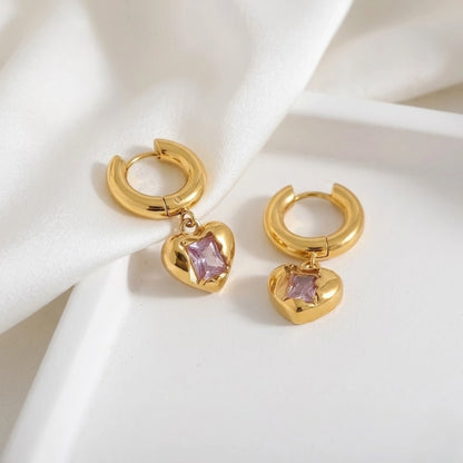 BEHI MILANO Lidia Earrings — gold pink zircon heart drop earrings styled on white marble display